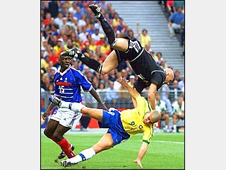 Photo Credit: Patrick Hertzog, AFP/Getty Images, of this view of "the clash of the chrome domes" between Brazil's Ronaldo and France's Fabien Barthez