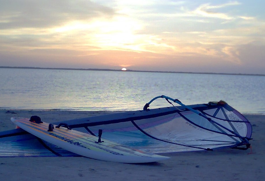 Sunset at Corpus Christi's Bird Island Basin, over windsurfer and sail.
