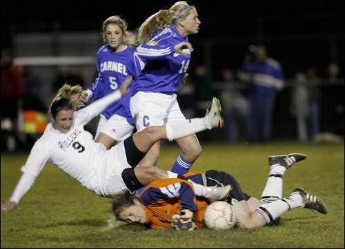 Photo Credit:  by Joe Vitti of The Indianapolis Star, "Carmel goalkeeper Emma Gormley is run over by Noblesville's Mary Kreger (9), with Carmel players Kate Hanni (5) and Jessica Rix (14) nearby."