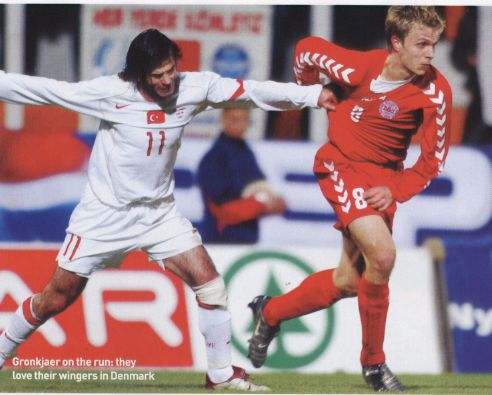 Image Credit:  FourFourTwo Magazine's Euro 2004 Guide, Page 29, where Danish winger Jesper Gronkjaer is in the red of Denmark.