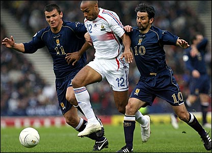 Photo Credit: BBC Soccer Site, photo of Henry being double teamed by Scotland defenders, "Scotland continue to hurry the French after the break and come close to breaking the deadlock but McFadden fires wide"