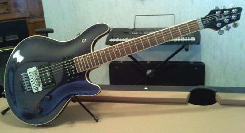 Model BT-10 Washburn Maverick Series electric guitar with archtop contoured body with transparent black finish and floyd rose tremolo and locking nut. Some consider this to be the supreme Washburn BT-Series guitar.