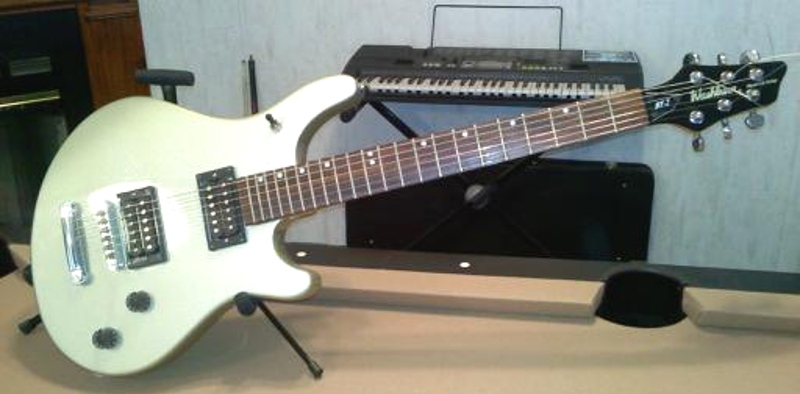 Washburn guitar Maverick Series Model BT-2 with metallic flake silver sparkle finish and Duncan Designed HB-102B and HB-102N set which mimick the Seymour Duncan Jazz and JB pickup combination.