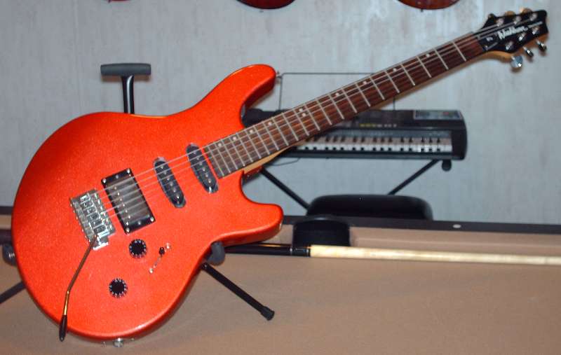 Washburn BT-4 guitar with a Seymour Duncan JB humbucker pickup in the bridge position and push pull coil tap switch