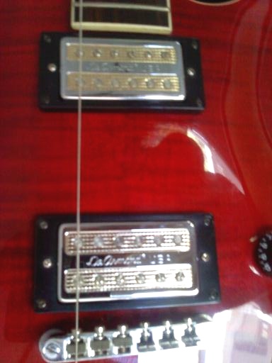 Image of the DeArmond Gold Tone pickups on the Washburn BT-8 electric guitar from the Maverick Series. The De Armond USA Gold Tone pickups were removed from a DeArmonde M-70 Les Paul style guitar.
