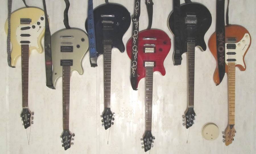 Here is the inverted pic of my Washburn Maverick Series guitar collection of Mike Kimbro of Grapevine, Texas USA, which includes a gorgeous BT-8 with upgraded DeArmond USA pickups, and a BT-10 with Floyd Rose tremolo and a Washburn 621 - 623 pickup set.