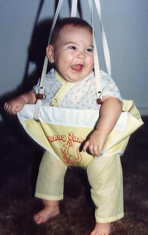 Here's a very young Marshall in the Johnny Jump Up at our home in Texas.
